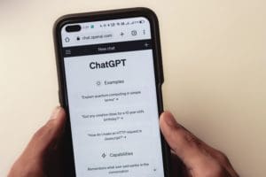 Person using Chat GPT AI chatbot on their cell phone